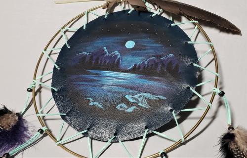 Mountain scene painted shield