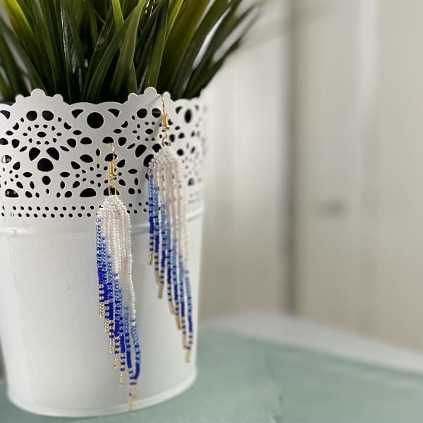 Asymmetrical blue and gold beaded fringed earrings 